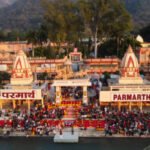 hindu temple filled with crowed at evening form religious prayer image is taken at parmarth niketan rishikesh uttrakhand india on Mar 15 2022.