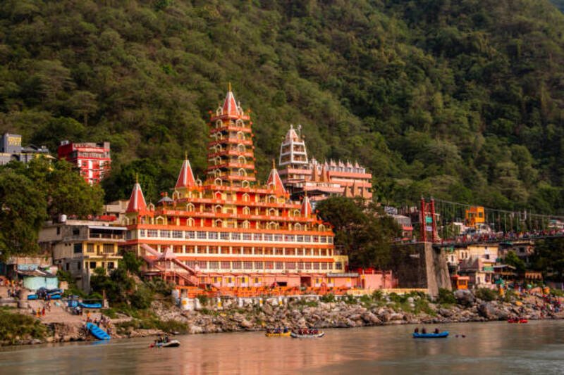 View of Ganga river embankment, Lakshman Jhula bridge and Tera Manzil Temple, Trimbakeshwar in Rishikesh